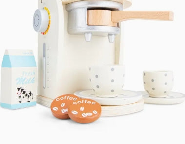 Children's toy coffee set with a pretend coffee machine, cups, and beans on a white background