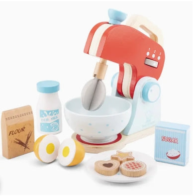 Toy kitchen set with mixer, bowls, and ingredients on a white background