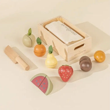 Wooden toy set with fruits and vegetables on a beige background