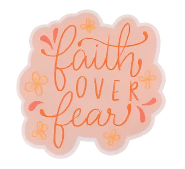 Decorative sticker with 'Faith Over Fear' text on a peach background