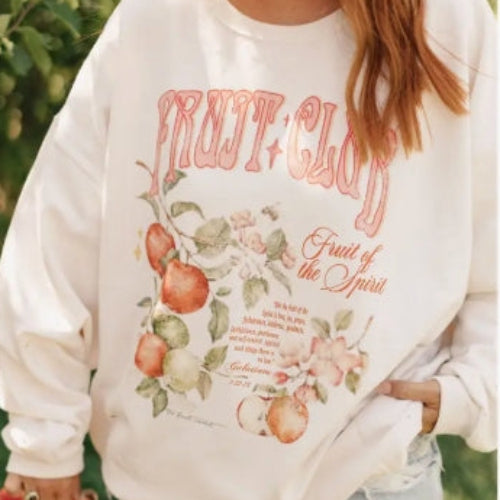 White sweatshirt with 'Fruit of the Spirit' design featuring apples and flowers.
