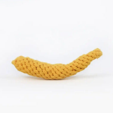 Yellow knitted banana-shaped toy on a white background