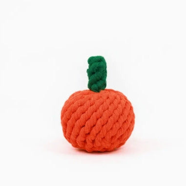 Orange rope toy shaped like an Orange with a green stem on a white background