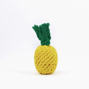 Knitted pineapple toy on a white background