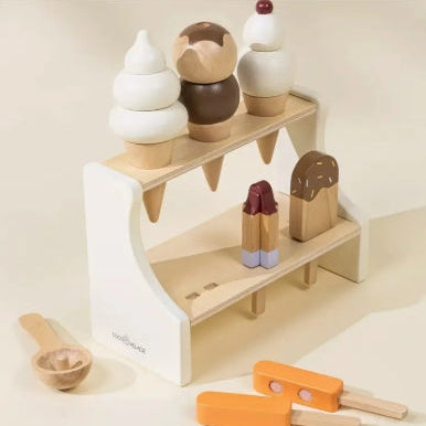Wooden toy ice cream set with a stand on a light background