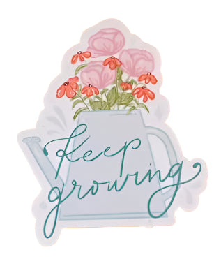 Sticker with floral design and 'Keep growing' text on an orange background