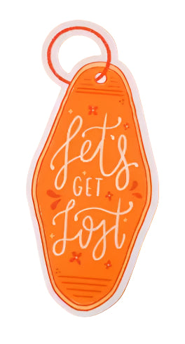Decorative key tag with 'let's get lost' text on an orange background
