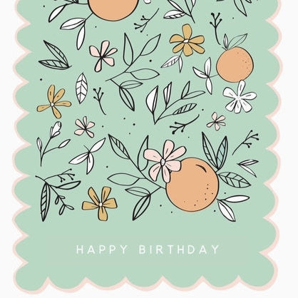 Birthday card with floral and fruit illustrations on a light green background