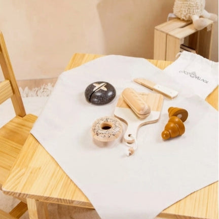 Wooden toys on a table with a white surface
