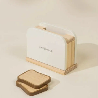 White toaster with wooden accents on a beige background