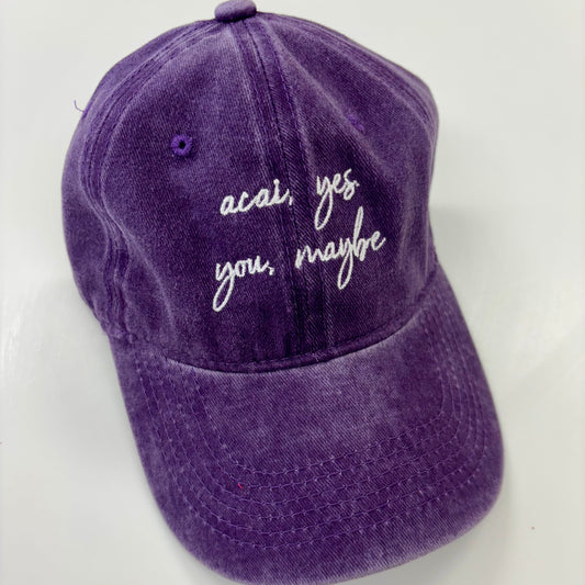 Purple cap with text on a white background