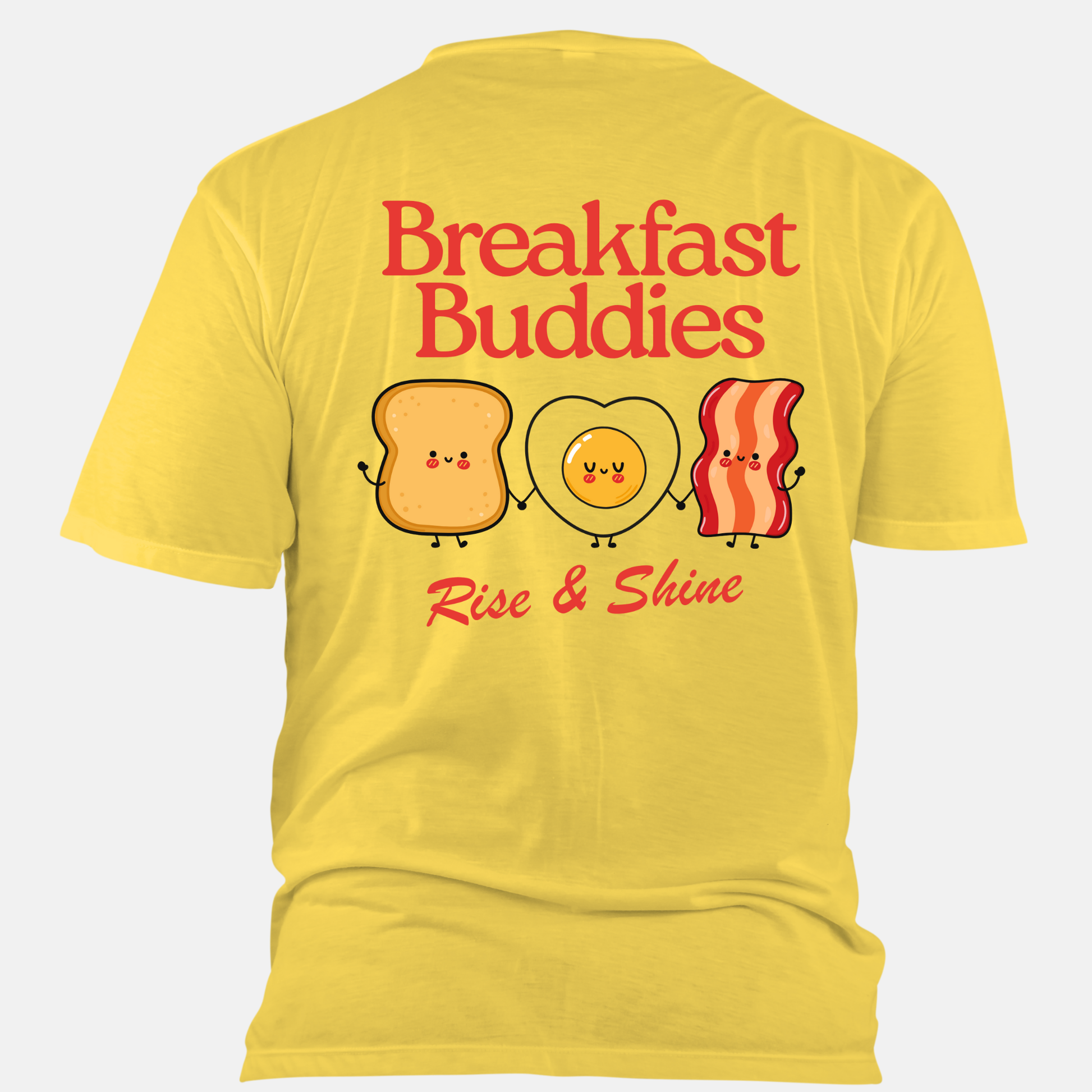 Yellow t-shirt with 'Breakfast Buddies Rise & Shine' design on a white background