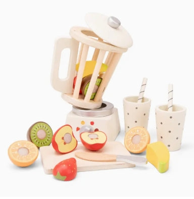 Wooden toy kitchen set with blender, fruits, and cups on a white background