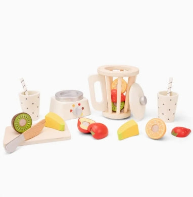 Set of wooden toy fruits and a toy kitchen set on a white background