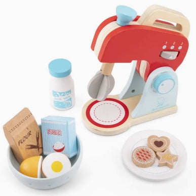 Wooden toy kitchen set with oven, ingredients, and cookies on a white background