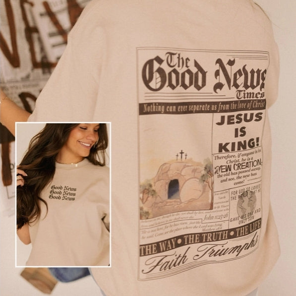 Beige t-shirt with 'The Good News Times' design featuring a cross and text.