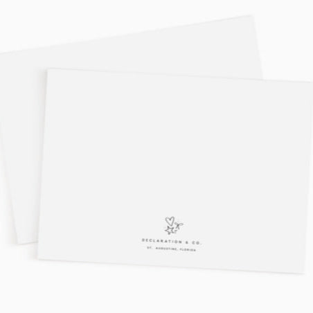 White pillowcases with a small logo and text on a white background
