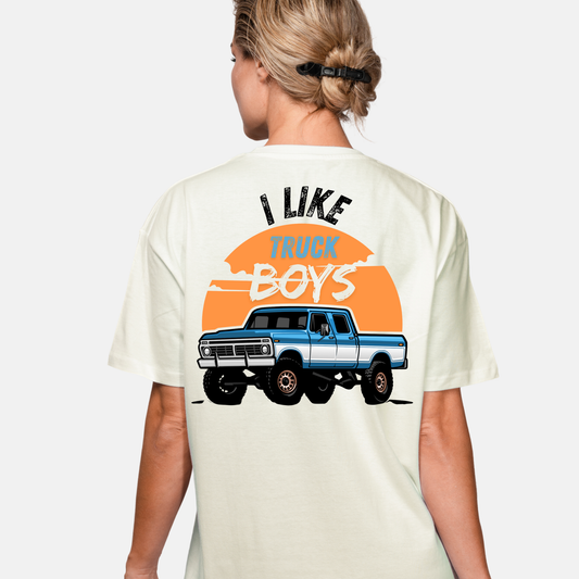 Person wearing a t-shirt with 'I Like Truck Boys' graphic on the back