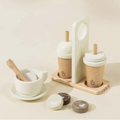 Set of wooden and ceramic kitchen items on a light background