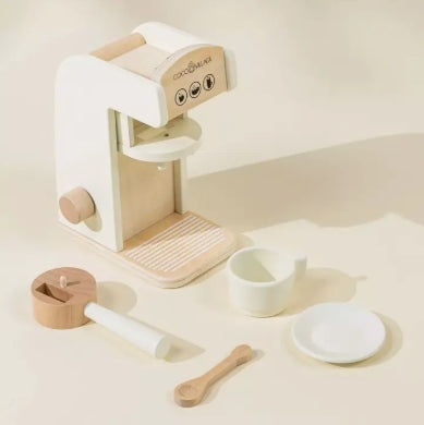 Wooden play kitchen set with white appliances on a light background